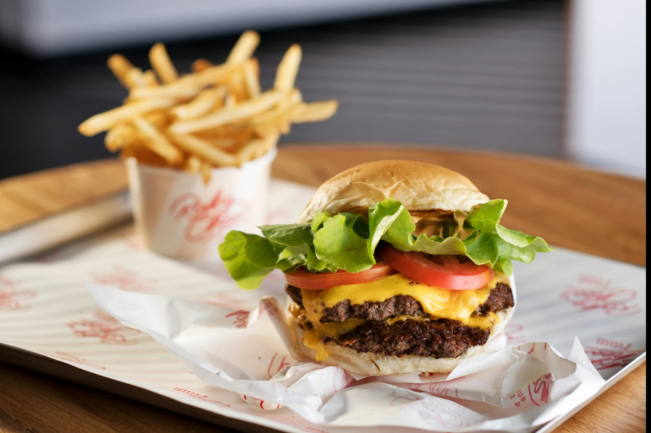 A Ruby Chews burger with melted cheese, fresh lettuce, tomato and golden fries